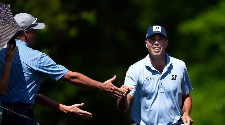 Matt Kuchar gets up close and personal with the gallery at the Houston Open this weekend. (Josh Hedges/Getty Images)