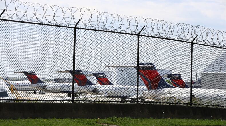 Delta jets are seen parked at Hartsfield-Jackson International Airport during the coronavirus slow down. Curtis Compton ccompton@ajc.com
