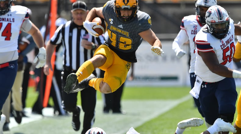Kennesaw State linebacker Bryson Armstrong (42) returns an interception for a touchdown against Robert Morris Saturday, March 3, 2021, at Fifth Third Bank Stadium in Kennesaw. (Hyosub Shin / Hyosub.Shin@ajc.com)