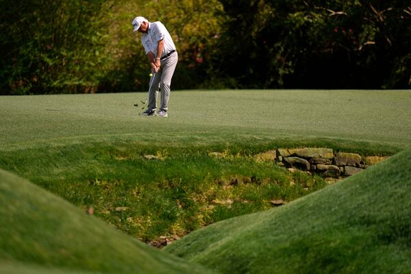 Fred Couples chips to the green on the 13th hole during the second round at the Masters golf tournament, Friday, April 11, 2025, in Augusta, Ga. (AP Photo/Julia Demaree Nikhinson)