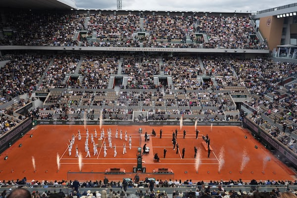 Dane group performs before the final match of the French Tennis Open at the Roland-Garros in Paris, Saturday, June 7, 2025. (AP Photo/Lindsey Wasson)