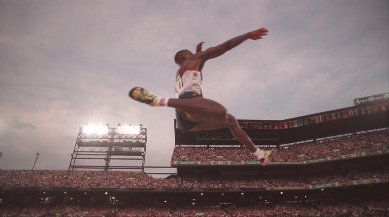 35-year-old Carl Lewis soared to the gold medal in the long jump at the 1996 Olympics in Atlanta. Lewis also won the event in the 1984, 1988 and 1992 Games. (Rich Addicks/AJC 1996)