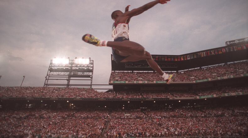 35-year-old Carl Lewis soared to the gold medal in the long jump at the 1996 Olympics in Atlanta. Lewis also won the event in the 1984, 1988 and 1992 Games. (AJC Staff Photo/Rich Addicks)