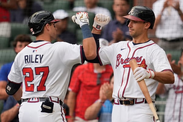 Braves third baseman Austin Riley celebrates his fifth inning home run with teammate Matt Olson.