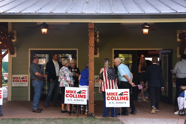 Attendees wait outside U.S. Senate candidate Mike Collins' primary election watch party at The Carmichael House in Jackson on Tuesday. (Arvin Temkar/AJC)