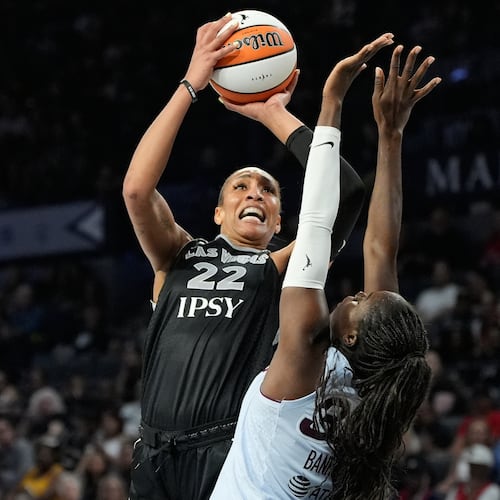 Las Vegas Aces center A'ja Wilson (22) shoots over Toronto Tempo guard Ornella Bankole (33) during the second half of a WNBA basketball game Friday, Aug. 28, 2026, in Las Vegas. (AP Photo/John Locher)