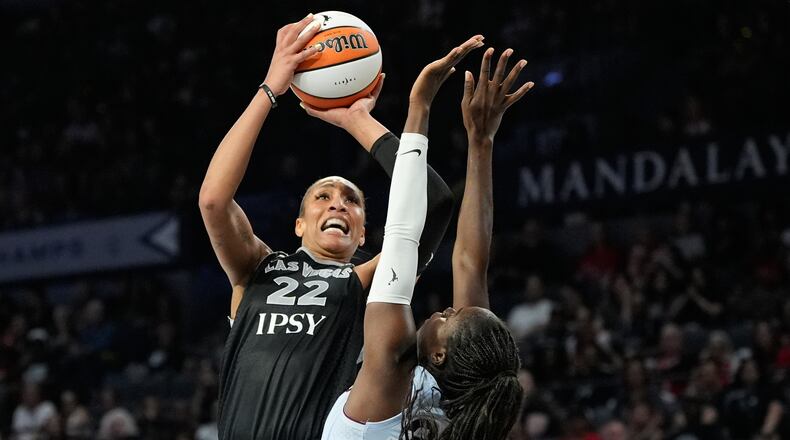 Las Vegas Aces center A'ja Wilson (22) shoots over Toronto Tempo guard Ornella Bankole (33) during the second half of a WNBA basketball game Friday, Aug. 28, 2026, in Las Vegas. (AP Photo/John Locher)