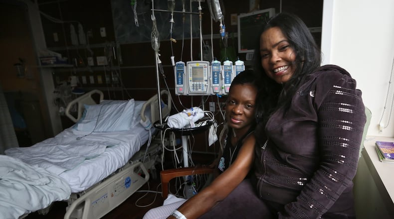 Tammika “Niki” Glass, 37, left, and Karen Tompkins, 52, photographed Monday, Jan. 26, 2015, became “heart sisters” at Northwestern Medical Center in Chicago, Ill., where they both waited for heart transplants. Contributed by Nancy Stone/Chicago Tribune/TNS