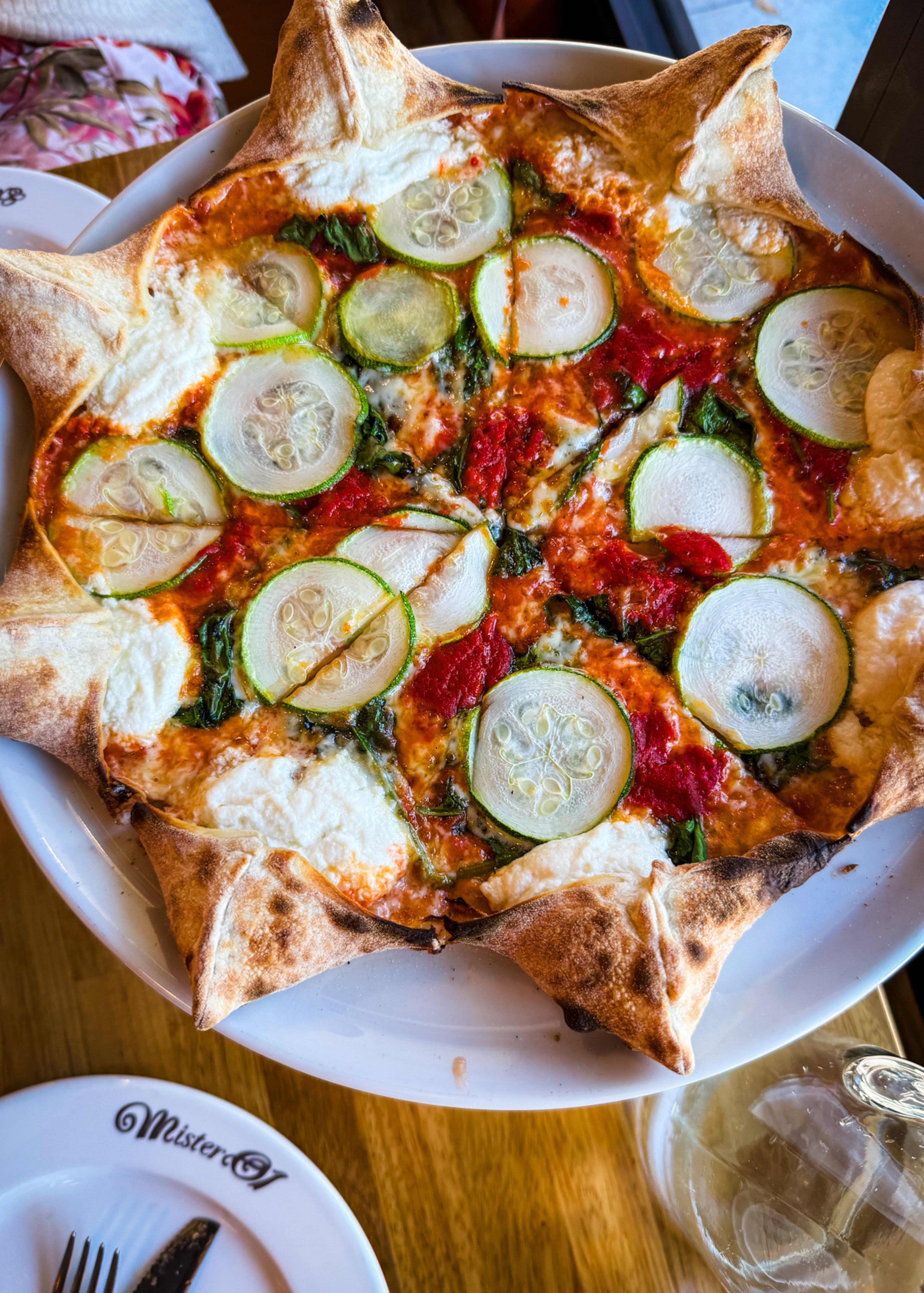 Mister O1 Extraordinary Pizza is known for its star-shaped pies, which include little pockets of ricotta in the crust. The Star Michele (pictured) is a vegetarian pizza that includes spinach, zucchini and roasted red pepper puree. (Henri Hollis/AJC)