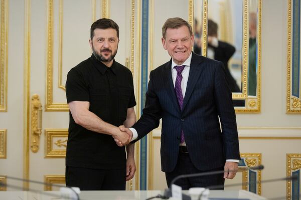 In this photo provided by the Ukrainian Presidential Press Office, Ukrainian President Volodymyr Zelenskyy, left, shakes hands with German Foreign Minister Johann Wadephul in Kyiv, Ukraine, Monday, June 30, 2025. (Ukrainian Presidential Press Office via AP)