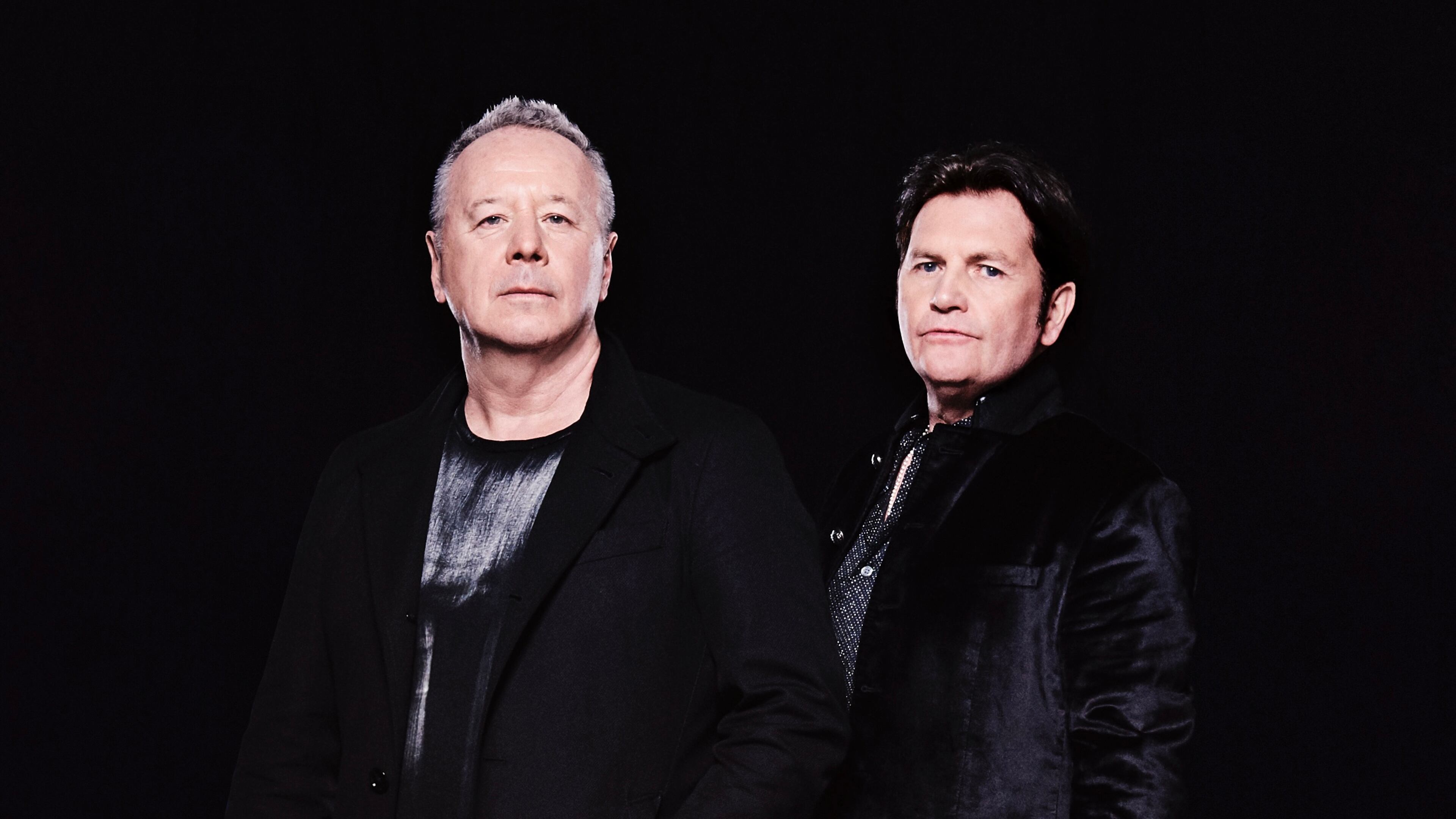 Simple Minds plays Synovus Bank Amphitheater at Chastain Park on June 7. "This is what we’ve always wanted to do — to have a great live band and take it all around the world,” says Jim Kerr (left) with co-founder Charlie Burchill. (Courtesy of Dean Chalkley)