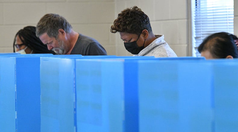 Gwinnett County residents cast their ballots at an early voting location in Mountain Park Activity Building in Stone Mountain on Saturday, October 22, 2022. (Hyosub Shin / Hyosub.Shin@ajc.com)