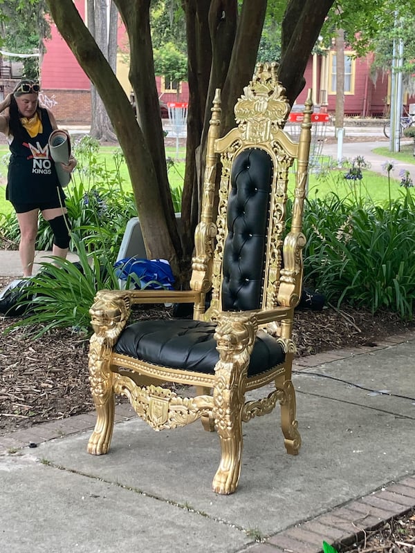 Organizers brought a throne to a "No Kings" protest in Savannah, Georgia on Saturday, June 14, 2025. (Adam Van Brimmer/AJC)