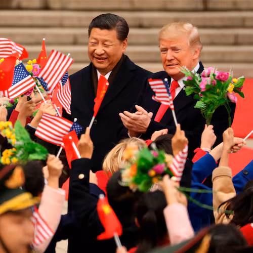 FILE - President Donald Trump and Chinese President Xi Jinping participate in a welcome ceremony at the Great Hall of the People in Beijing, China, Nov. 9, 2017. (AP Photo/Andrew Harnik, File)