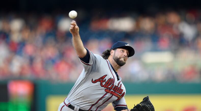 Braves starting pitcher R.A. Dickey delivers a pitch against the Washington Nationals. (AP Photo/Nick Wass)