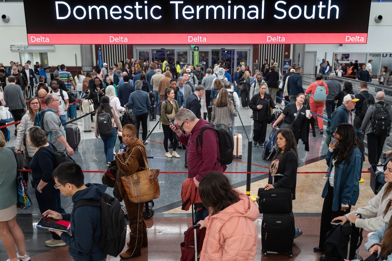 Morning travelers line up inside the south terminal at Hartsfield-Jackson Atlanta International Airport amid the ongoing partial government shutdown, Thursday, March 26, 2026. (Ben Hendren for the AJC)