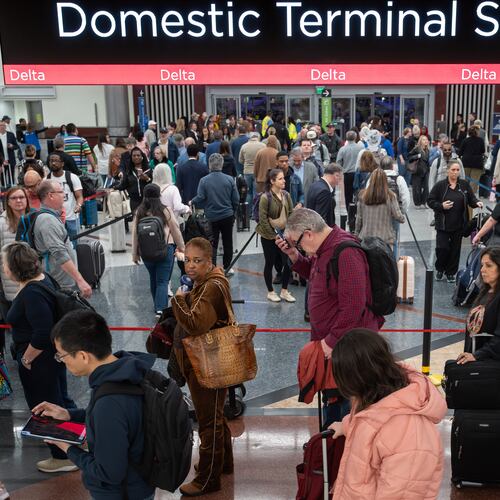 Morning travelers line up inside the south terminal at Hartsfield-Jackson Atlanta International Airport amid the ongoing partial government shutdown, Thursday, March 26, 2026. (Ben Hendren for the AJC)