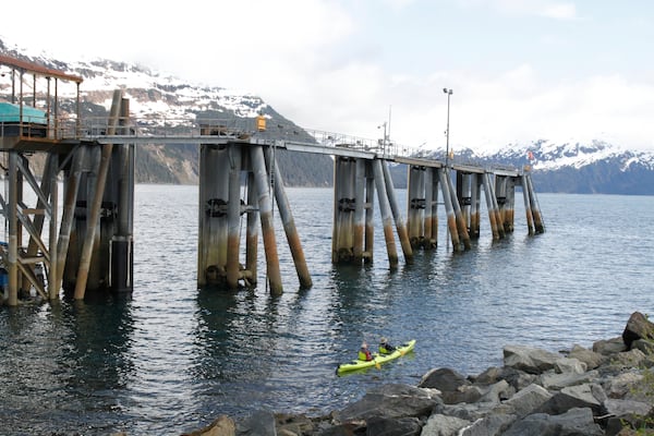 HOLD FOR STORY - Two people kayak around Blackstone Bay in Whittier, Alaska on May 13, 2025. (AP Photo/Mark Thiessen)