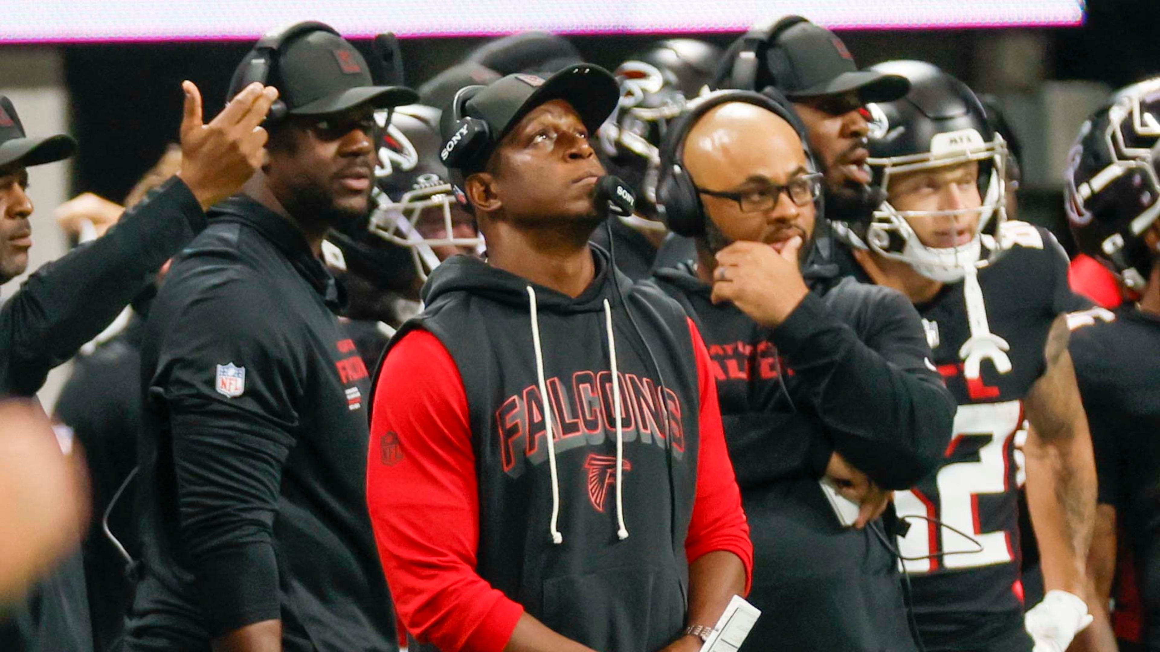 Falcons head coach Raheem Morris takes a peek at the scoreboard against Tampa. (Miguel Martinez/AJC)