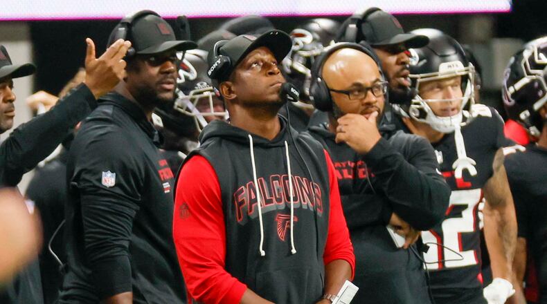 Falcons coach Raheem Morris looks at the clock during the Sept. 7 game. He might need to look at his offensive coordinator if he wants the Falcons to win. (Miguel Martinez/AJC)