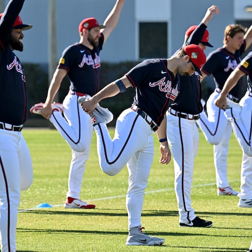 Braves pitcher Spencer Strider (center) — pictured during pitcher and catcher workouts in February — left his start Friday with right elbow and shoulder discomfort. After being evaluated Monday, Strider will be shut down for a month then reevaluated. (Hyosub Shin/AJC)