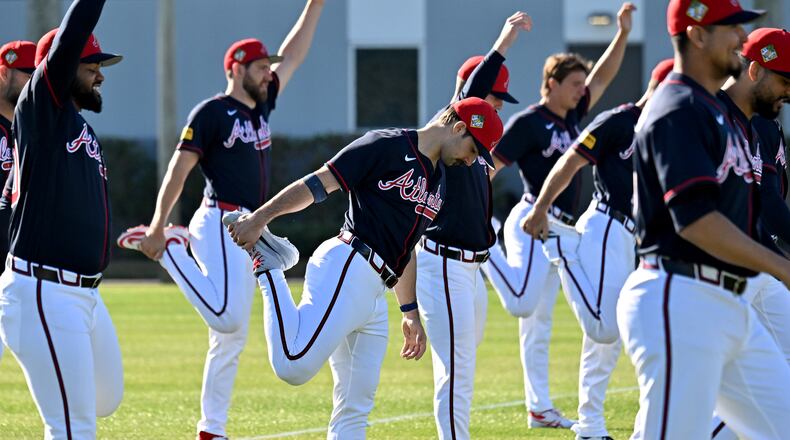 Braves pitcher Spencer Strider (center) — pictured during pitcher and catcher workouts in February — left his start Friday with right elbow and shoulder discomfort. After being evaluated Monday, Strider will be shut down for a month then reevaluated. (Hyosub Shin/AJC)
