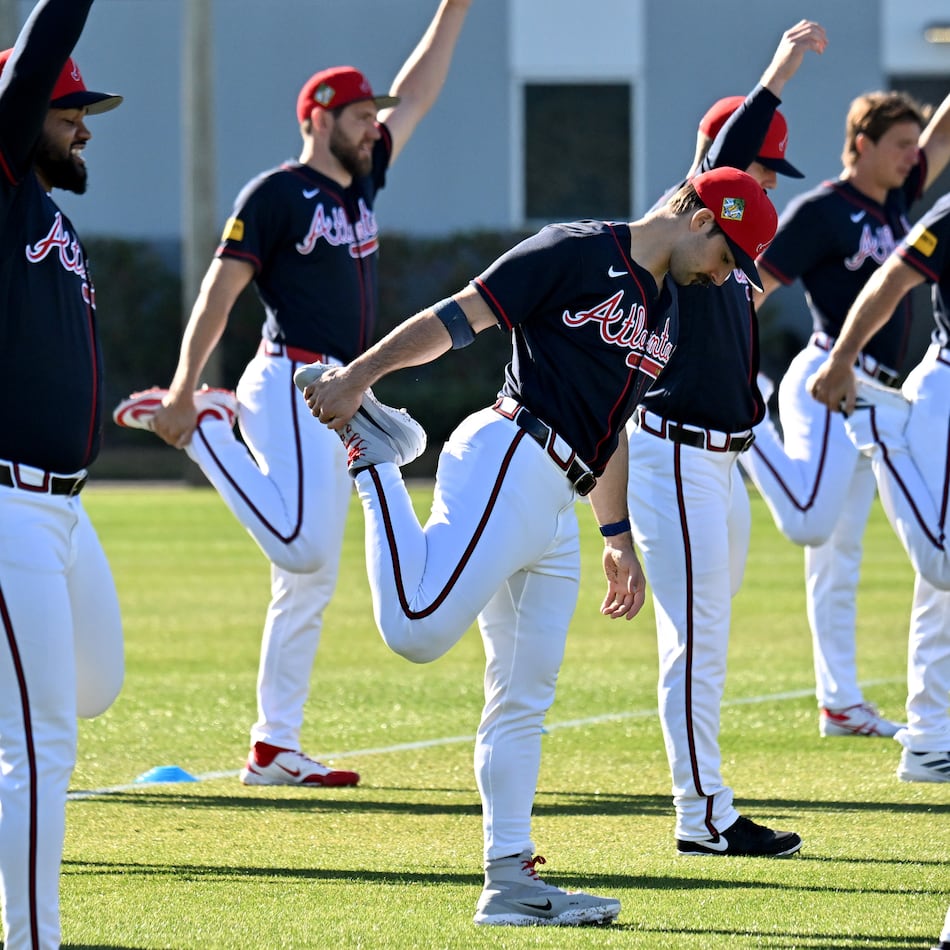 Braves pitcher Spencer Strider (center) — pictured during pitcher and catcher workouts in February — left his start Friday with right elbow and shoulder discomfort. After being evaluated Monday, Strider will be shut down for a month then reevaluated. (Hyosub Shin/AJC)
