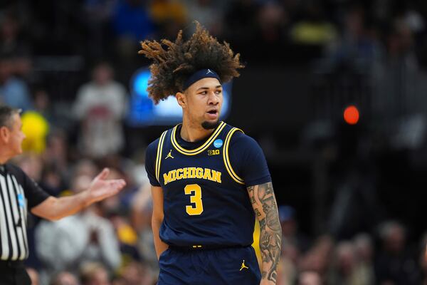 Michigan guard Tre Donaldson reacts after hitting a 3-point basket against Texas A&M during the second half in the second round of the NCAA college basketball tournament Saturday, March 22, 2025, in Denver. (AP Photo/David Zalubowski)