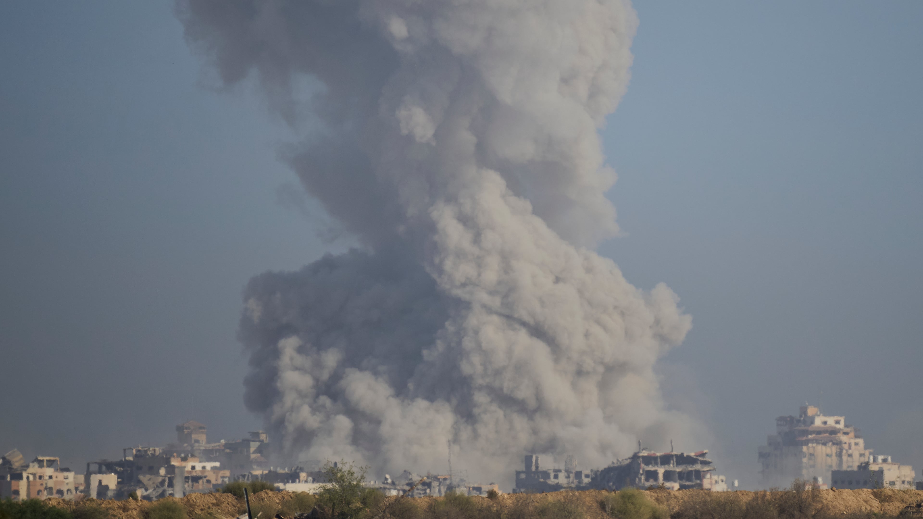 Smoke rises following an explosion in the Gaza Strip, as seen from southern Israel, Sunday, Sept. 21, 2025. (AP Photo/Ohad Zwigenberg)