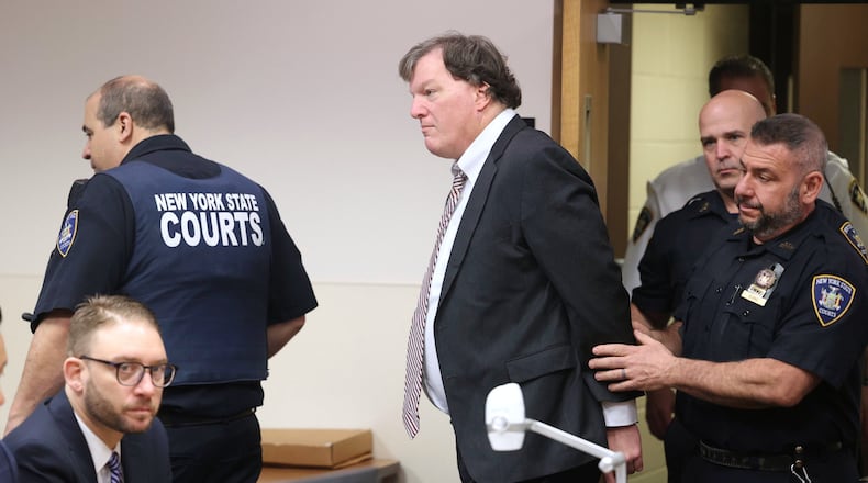 FILE - Alleged Gilgo serial killer Rex Heuermann is led into courtroom for a Frye hearing at Suffolk County Court in Riverhead, N.Y., April 3, 2025. (James Carbone/Newsday via AP, File)