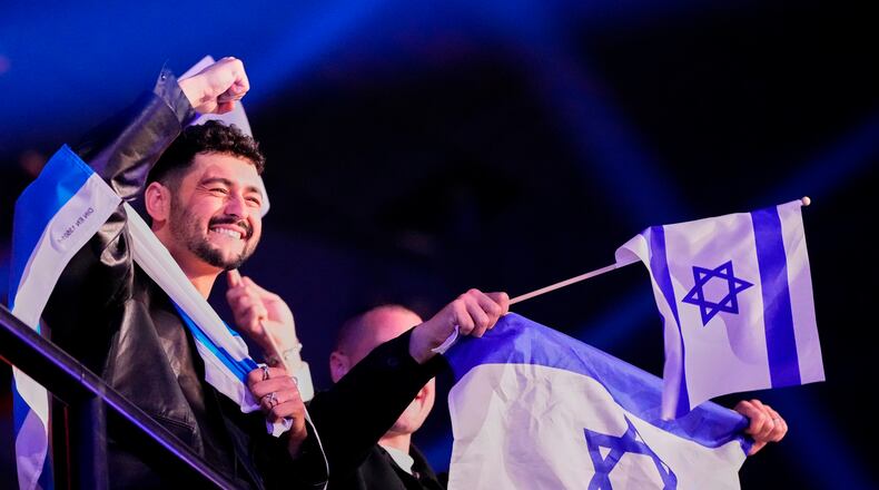 Noam Bettan from Israel performs the song "Michelle" reacts to the vote totals being announced during the first semifinal of the 70th Eurovision Song Contest in Vienna, Austria, Tuesday, May 12, 2026. (AP Photo/Martin Meissner)