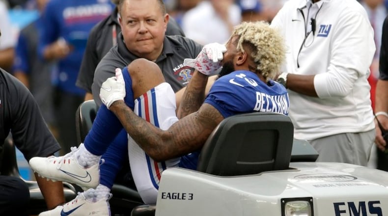 New York Giants wide receiver Odell Beckham is take off the field on a cart after an injury during the second half of an NFL football game against the Los Angeles Chargers, Sunday, Oct. 8, 2017, in East Rutherford, N.J. (AP Photo/Seth Wenig)