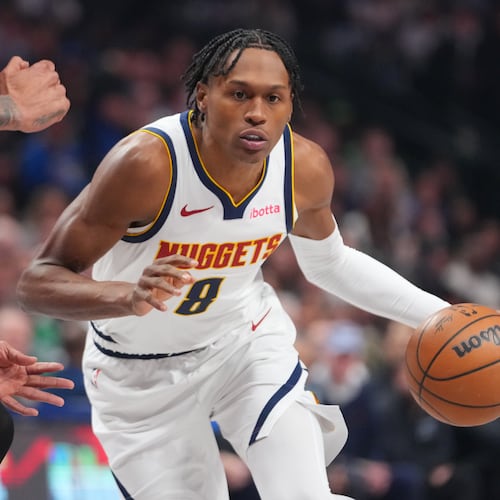 FILE - Denver Nuggets guard Peyton Watson (8) drives to the basket during the first half of an NBA basketball game between the Dallas Mavericks and the Denver Nuggets, on Jan. 14, 2026, in Dallas. (AP Photo/Julio Cortez, File)