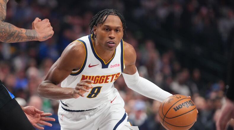 FILE - Denver Nuggets guard Peyton Watson (8) drives to the basket during the first half of an NBA basketball game between the Dallas Mavericks and the Denver Nuggets, on Jan. 14, 2026, in Dallas. (AP Photo/Julio Cortez, File)