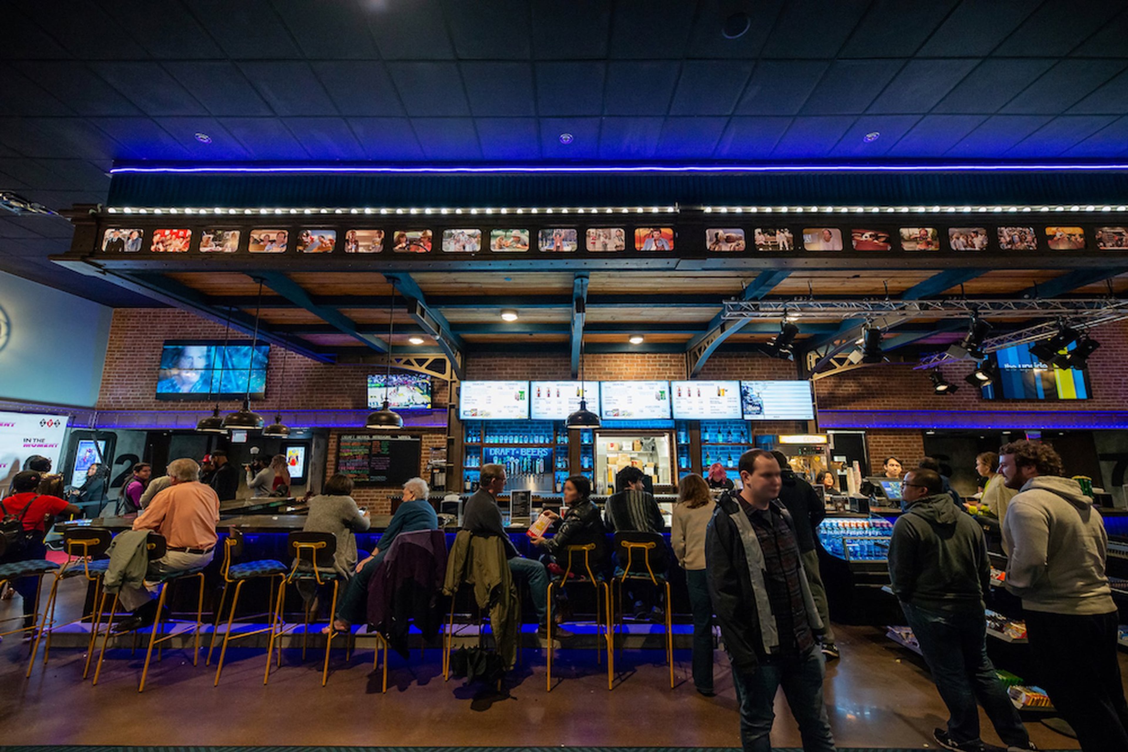 The bar at The Springs Cinema & Taphouse in Sandy Springs features more than a dozen local and craft beers on tap, as well as specialty cocktails and wines by the glass or bottle. (Courtesy of Jarrod Cecil Photography)