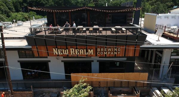 New Realm Brewing Co. is known for its rooftop bar that looks out over the Beltline. (Steve Schaefer for the AJC)