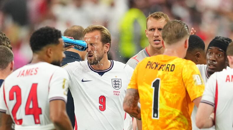 England's Harry Kane (9) cools off during a hydration break of the World Cup Group L soccer match between England and Croatia in Arlington, Texas, near Dallas, Wednesday, June 17, 2026. (AP Photo/Julio Cortez)