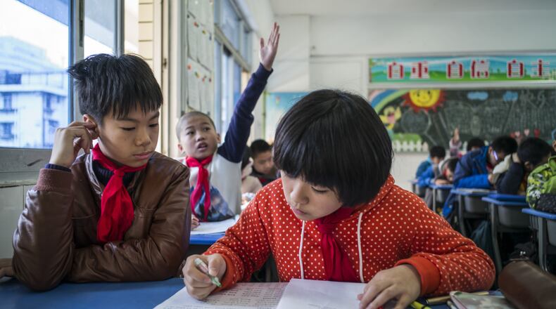 Students attend classes at a primary school in Fuzhou, China,