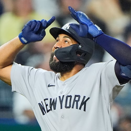 New York Yankees' Amed Rosario celebrates after hitting a two-run home run during the ninth inning of baseball game against the Kansas City Royals, Tuesday, May 26, 2026, in Kansas City, Mo. (AP Photo/Charlie Riedel)