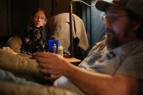 Leslie Stewart, left, sits inside her living room with her husband, Danny, right, Monday, Feb. 17, 2025, in Wellston, Okla. (AP Photo/Joshua A. Bickel)