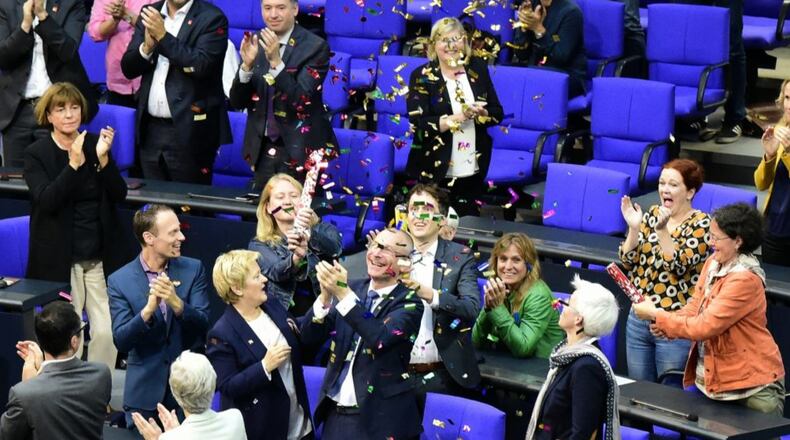 Green party members celebrate with confetti following a debate and vote on same-sex marriage in the Bundestag on Friday.