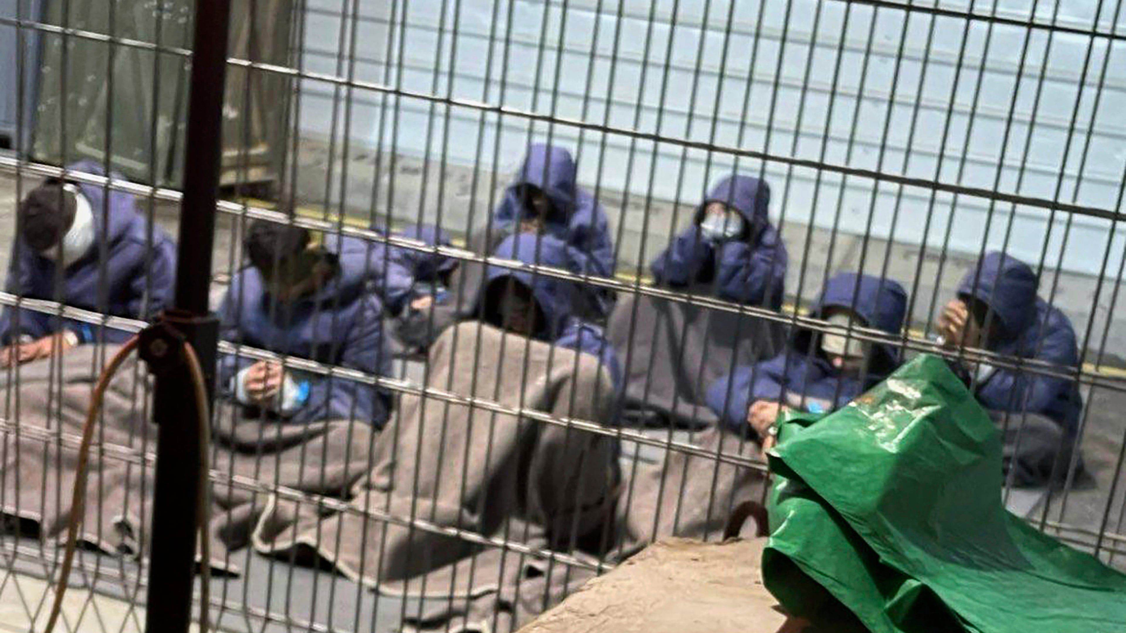 This 2024 photo provided by Breaking The Silence, a whistleblower group of former Israeli soldiers, shows prisoners with their hands and legs restrained in the yard at the Sde Teiman military prison in southern Israel. (Breaking The Silence via AP)