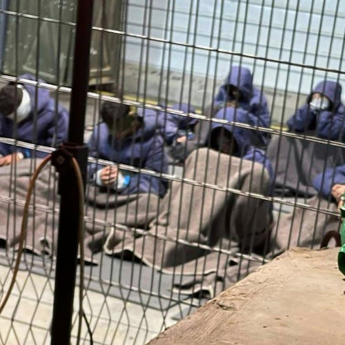 This 2024 photo provided by Breaking The Silence, a whistleblower group of former Israeli soldiers, shows prisoners with their hands and legs restrained in the yard at the Sde Teiman military prison in southern Israel. (Breaking The Silence via AP)