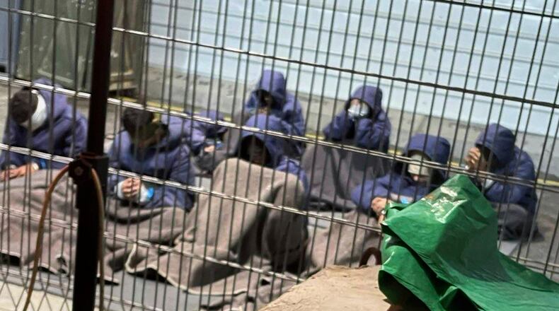 This 2024 photo provided by Breaking The Silence, a whistleblower group of former Israeli soldiers, shows prisoners with their hands and legs restrained in the yard at the Sde Teiman military prison in southern Israel. (Breaking The Silence via AP)