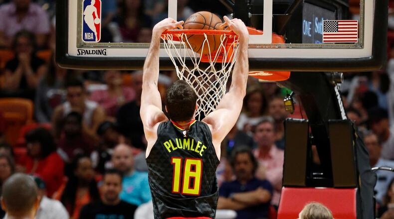 Hawks center Miles Plumlee (18) dunks during the first half of the team's NBA basketball game against the Miami Heat, Tuesday, April 3, 2018, in Miami. (AP Photo/Wilfredo Lee)