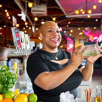Acclaimed mixologist Tiffanie Barriere, aka the Drinking Coach, seen here mixing cocktails at Monday Night Brewing. Barriere was miffed when she moved to Atlanta around 2000 only to find that Juneteenth was not celebrated with the same enthusiasm as in her native region of South Texas and Western Louisiana. (Courtesy of Monday Night Brewing)