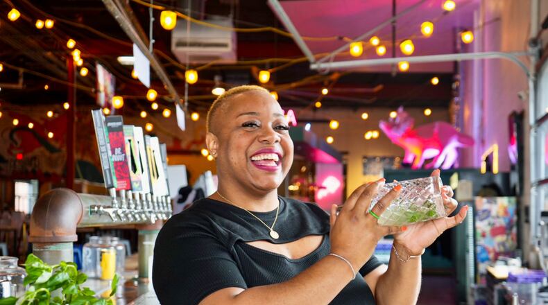 Acclaimed mixologist Tiffanie Barriere, aka the Drinking Coach, seen here mixing cocktails at Monday Night Brewing. Barriere was miffed when she moved to Atlanta around 2000 only to find that Juneteenth was not celebrated with the same enthusiasm as in her native region of South Texas and Western Louisiana. (Courtesy of Monday Night Brewing)