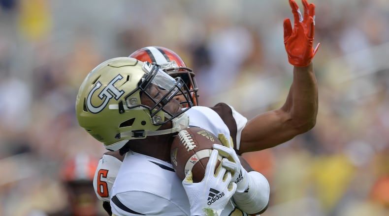 Georgia Tech wide receiver Jalen Camp (80) catches a pass under pressure from Bowling Green defensive back Montre Gregory (6) in the second half at Bobby Dodd Stadium on Saturday, September 29, 2018.  HYOSUB SHIN / HSHIN@AJC.COM