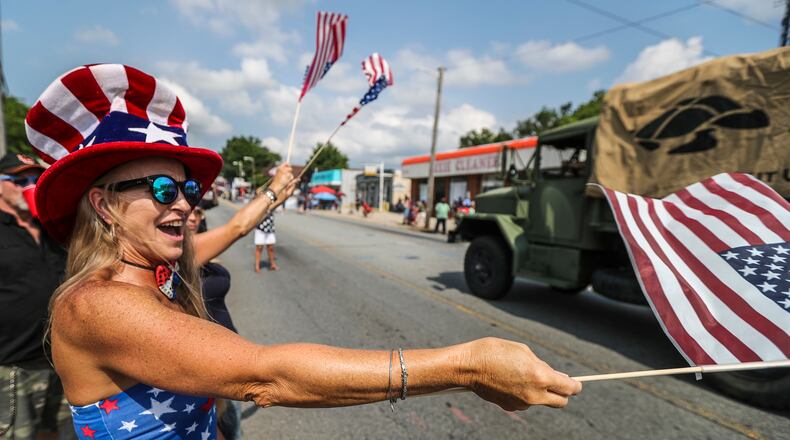 July 4, 2018 Cobb County: Karen Larkin was feeling her patriotism along Roswell Street. The city of Marietta's Fourth in the Park celebration includes a parade, free live concerts, museum tours, arts and crafts show, food, carnival games and a fireworks finale. JOHN SPINK/JSPINK@AJC.COM