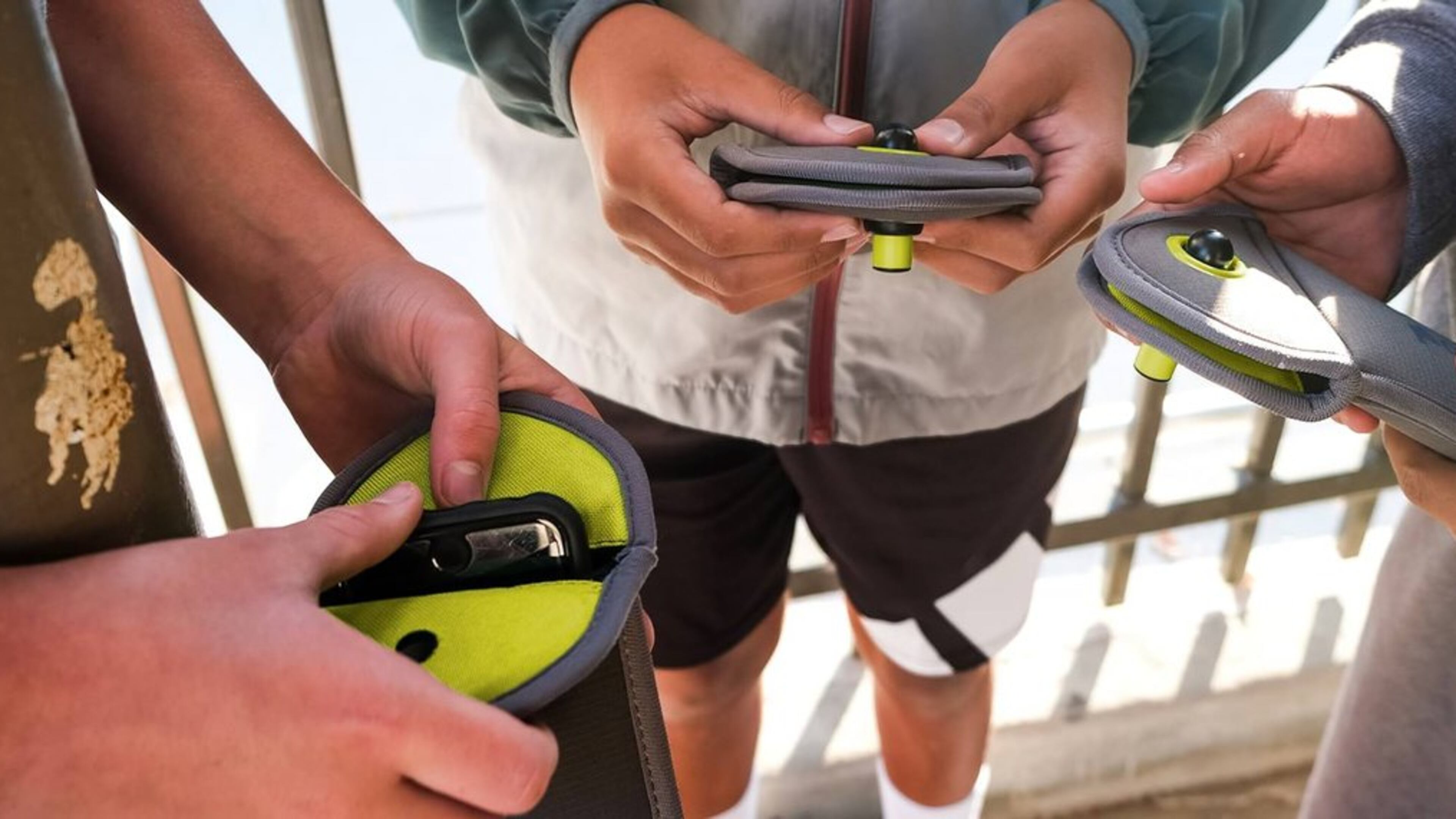 Students put their phones in Yondr pouches, which are designed to keep students from accessing their devices during class time. APS' police chief says keeping kids off their phones during the day is a good idea. (Photo courtesy Yondr)